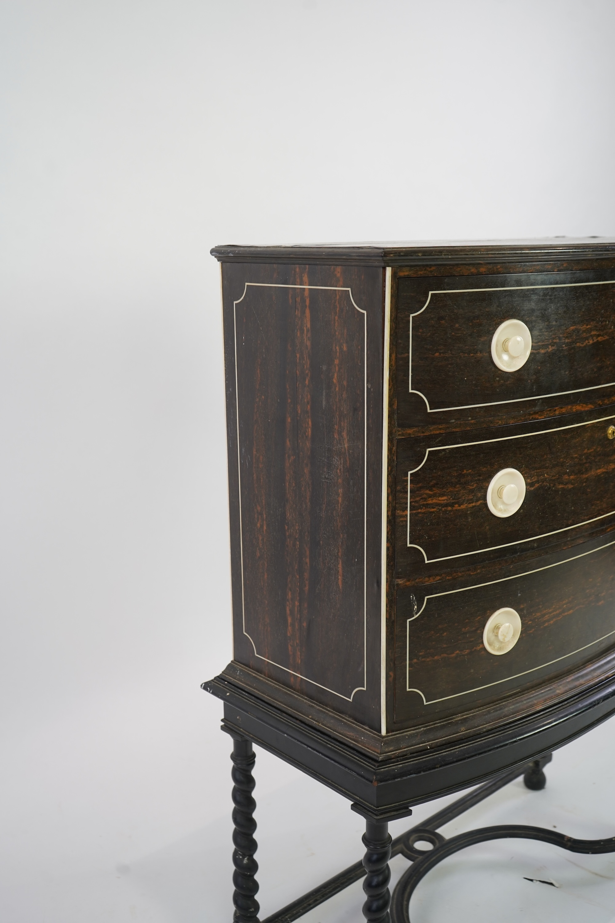 An early 20th century ivory mounted coromandel three drawer bowfront chest, stamped Callow of Mount Street, London